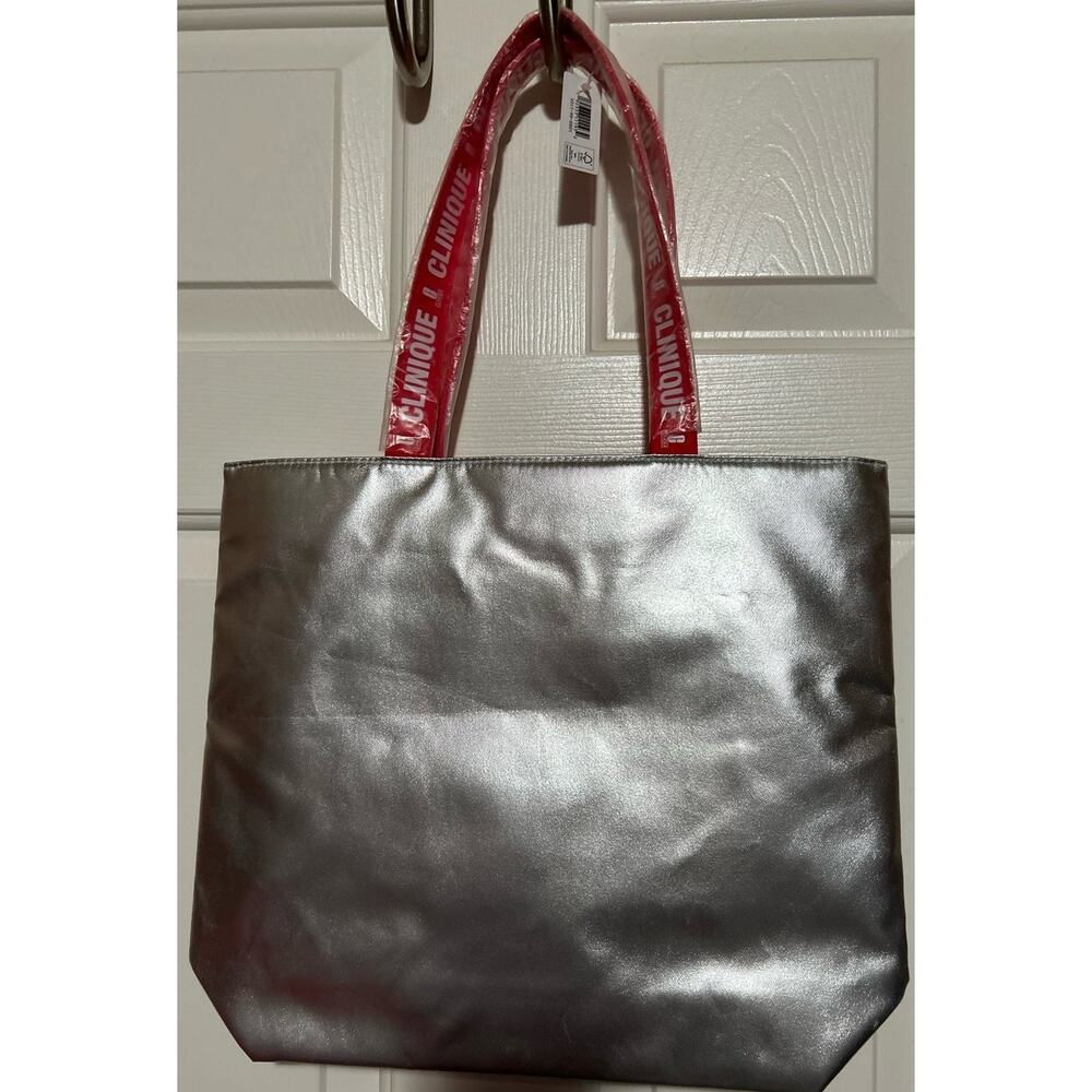 Clinique Women's Silver Tote Bag Peppermint Swirl Pattern Inside Tote Red Handle